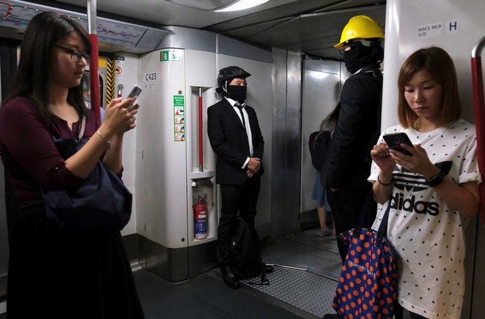 Anti-extradition bill demonstrators wearing helmets are seen inside a Mass Transit Railway (MTR) train in Hong Kong, China July 30, 2019. u00e2u20acu201d Reuters pic