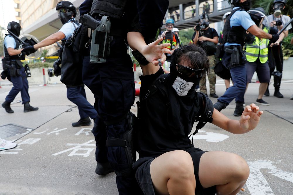 Riot police detain an anti-extradition bill protesters during a march to demand democracy and political reforms, at Kowloon Bay, in Hong Kong, China August 24, 2019. u00e2u20acu201d Reuters pic