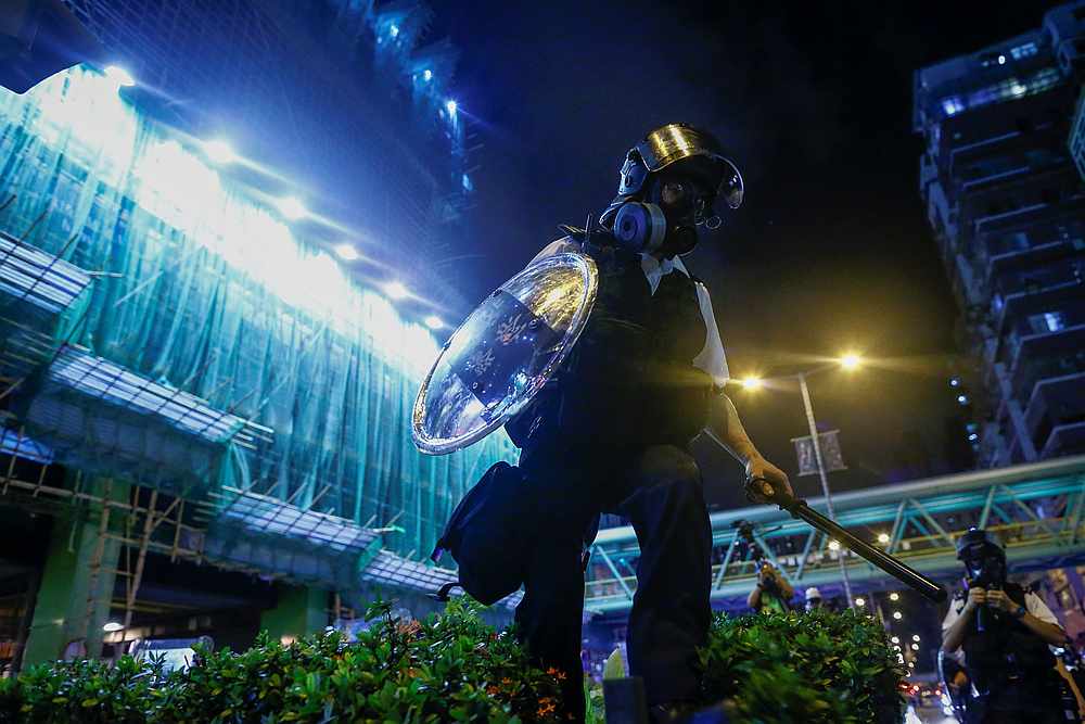 A police officer advances during clashes with an anti-extradition bill protester in Sham Shui Po in Hong Kong August 14, 2019. u00e2u20acu201d Reuters pic