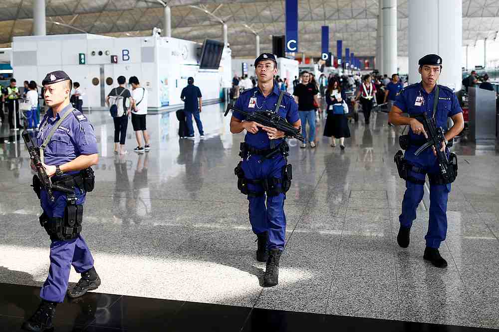 Armed police patrol the departure hall of the airport in Hong Kong after previous night's clashes with protesters, August 14, 2019. u00e2u20acu201d Reuters pic