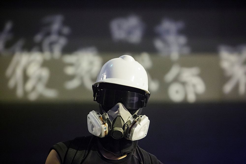 A protester stands in front of graffiti outside the People's Liberation Army (PLA) headquarters during a pro-democracy rally in Hong Kong August 18, 2019. u00e2u20acu201d Reuters pic