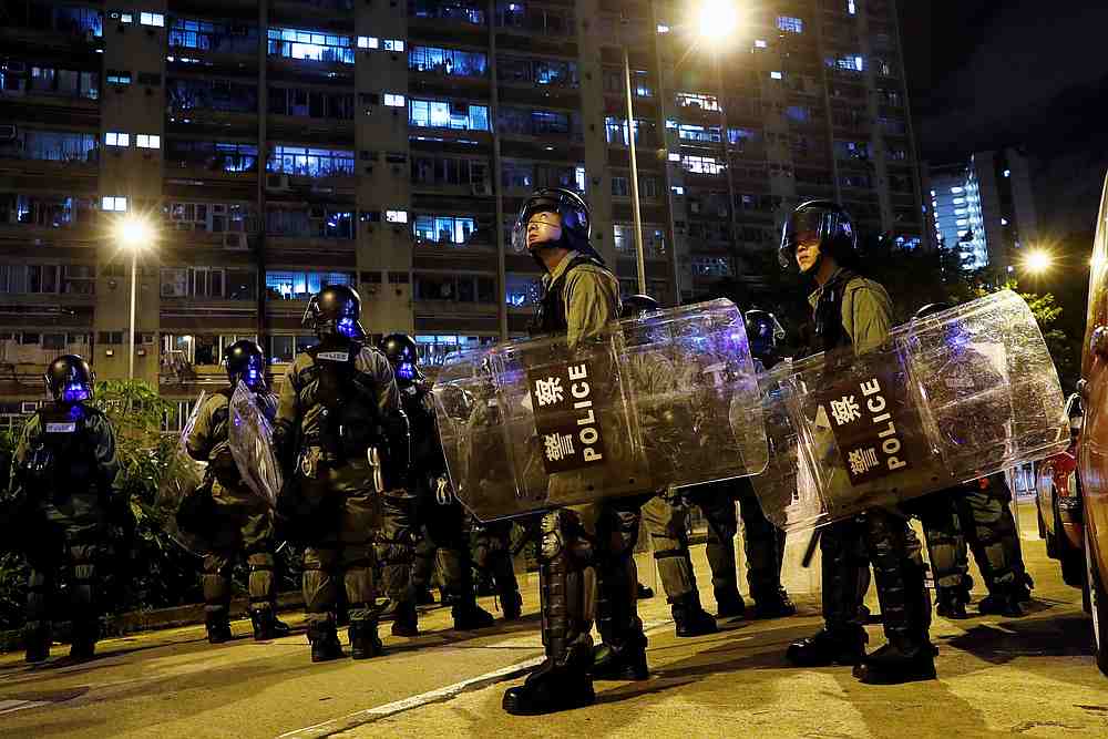 Riot police stand guard at Wong Tai Sin, a residential area, after an anti-extradition bill protest in Hong Kong, August 4, 2019. u00e2u20acu201d Reuters pic