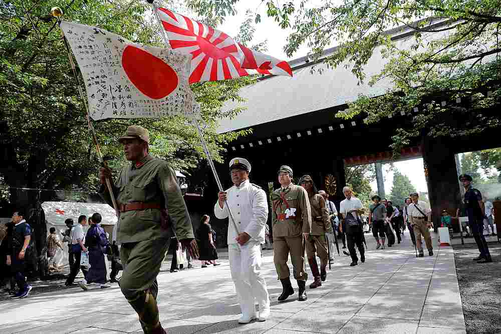 Men wearing Japanese imperial military uniform visit the Yasukuni Shrine in Tokyo August 15, 2019 on the 74th anniversary of Japan's surrender in World War Two. u00e2u20acu201d Reuters pic