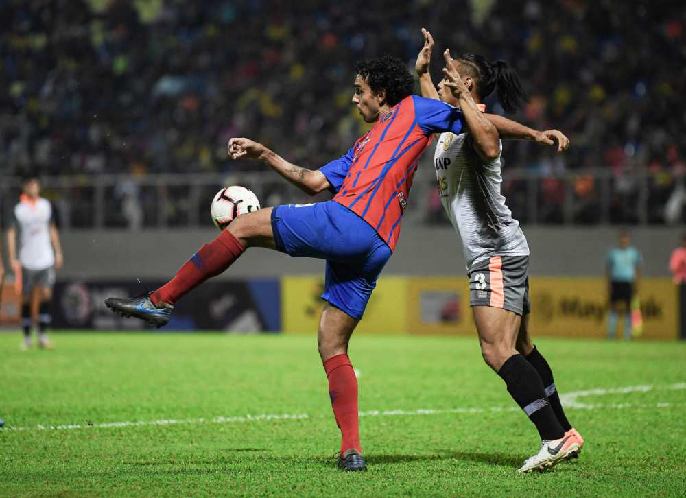 JDTu00e2u20acu2122s Diogo Luis Santo (left) during the match against PKNP FC at the Manjung Municipal Council Stadium in Perak last night. u00e2u20acu2022 Bernama pic
