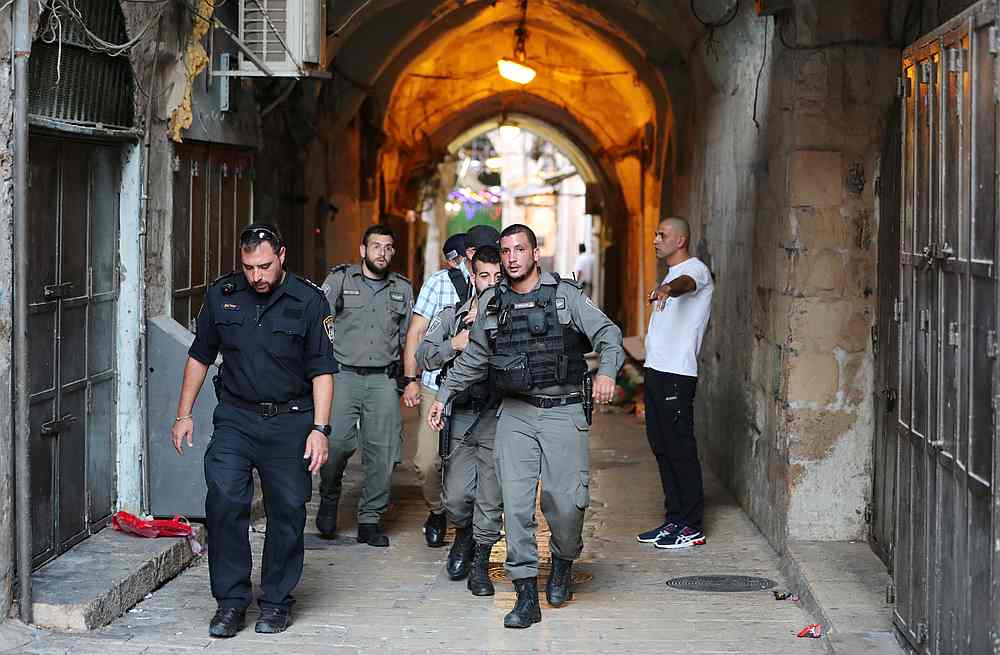 Israeli security personnel walk near the scene where Palestinians were shot by Israeli police after carrying out what Israeli police spokesman said was a stabbing attack in Jerusalem's old city August 15, 2019. u00e2u20acu201d Reuters pic