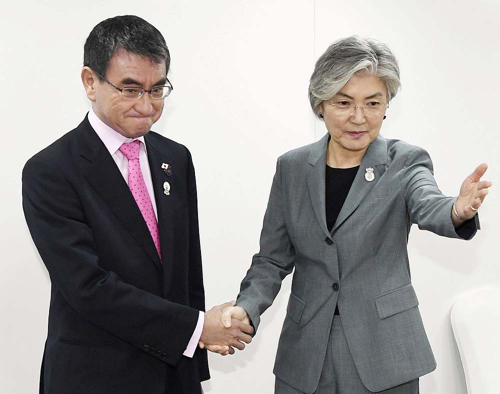 South Korean Foreign Minister Kang Kyung-wha (right) meets her Japanese counterpart Taro Kono during the Asean Foreign Ministers' Meeting in Bangkok August 1, 2019. u00e2u20acu201d Kyodo pic via Reuters