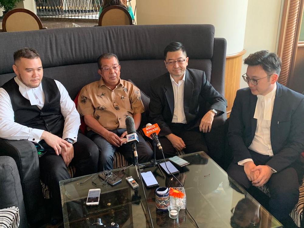 Datuk Karim Bujang (centre) with his lawyers Frederic Chang (2nd right), Syaiful Sufyyan Sidin (left) and Wilson Lai (right). u00e2u20acu201d Picture by Julia Chan