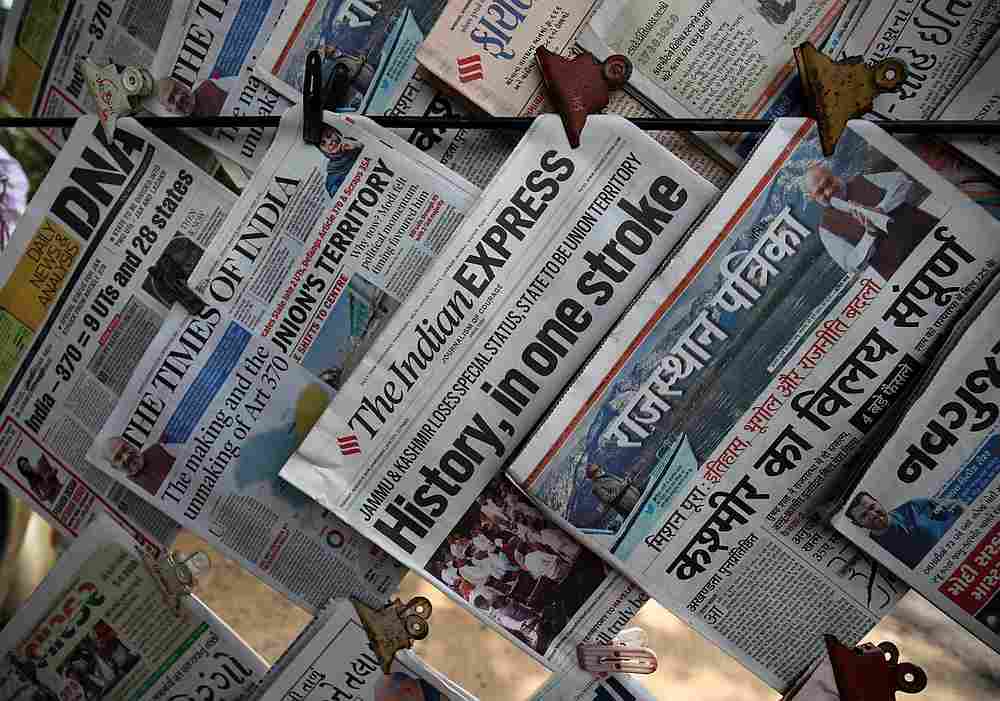 Newspapers, with headlines about Prime Minister Narendra Modi's decision to revoke special status for the disputed Kashmir region, are displayed for sale at a pavement in Ahmedabad, India August 6, 2019. u00e2u20acu201d Reuters pic