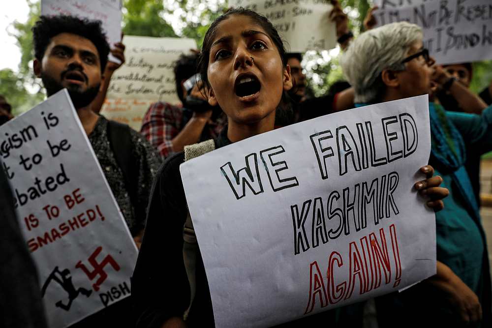 People hold signs and shout slogans during a protest after the government scrapped the special status for Kashmir, in New Delhi, India August 5, 2019. u00e2u20acu201d Reuters pic