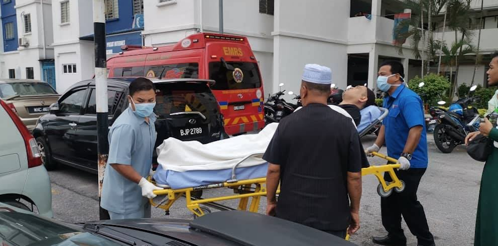 A man is stretchered from the scene. — Picture via Twitter/Bernamadotcom