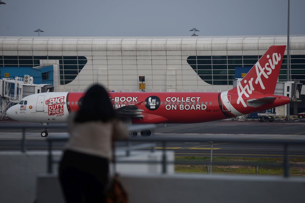 An AirAsia plane is pictured on the tarmac of the Kuala Lumpur International Airport in Sepang August 20, 2019. u00e2u20acu201d Picture by Miera Zulyana