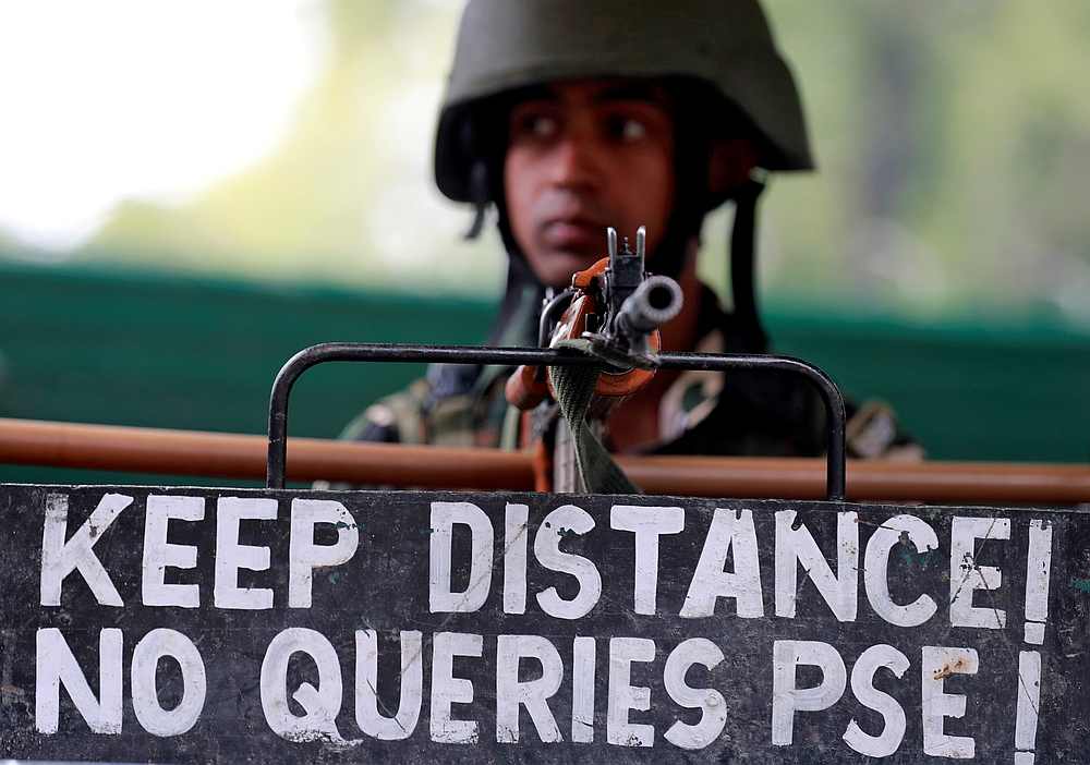 An Indian security force personnel keeps guard alongside a road during restrictions after the government scrapped the special constitutional status for Kashmir, in Srinagar August 15, 2019. u00e2u20acu201d Reuters pic