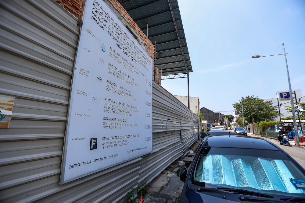 The two godowns on Victoria Street have been left uncompleted after the previous landowner took the state government to court. — Picture by Sayuti Zainudin