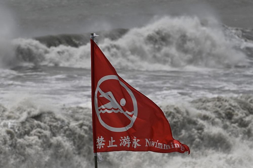 A flag warning about rough seas is pictured next to a beach in Suao, Yilan county, as Typhoon Lekima approaches the shores of eastern Taiwan August 8, 2019. u00e2u20acu201d AFP pic