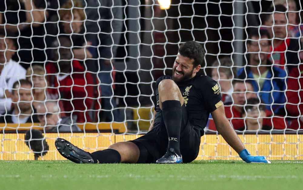 Liverpool's Alisson reacts after sustaining an injury during the match against Norwich City, August 9, 2019. u00e2u20acu2022 Reuters pic