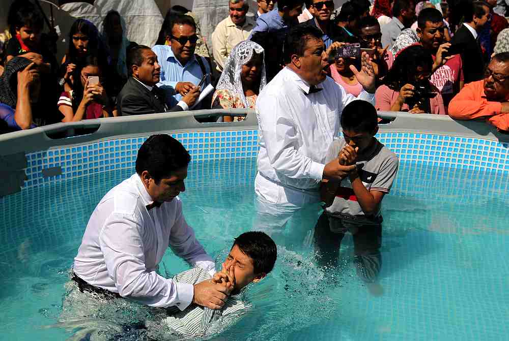 Followers of the Mexican-based Pentecostal church Light of the World, participate in a baptism ceremony in Guadalajara, Jalisco state, Mexico August 12, 2019. u00e2u20acu201d AFP pic