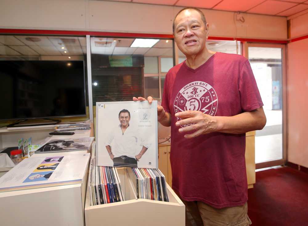 For the love of music, Max Yeoh offers a collection of CDs and vinyls at De Music Shoppe in Ipoh. u00e2u20acu2022 Picture by Farhan Najib