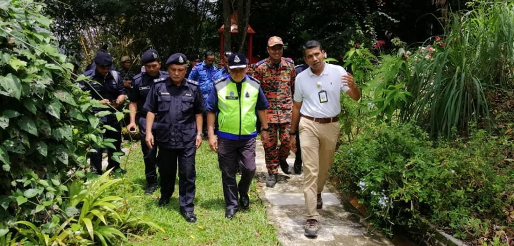 Datuk Mazlan Mansor being shown around The Dusun resort by Negri Sembilan deputy police chief Datuk Mohamad Mat Yusop (left) and International Relations IGP Secretariat Office ACP Nik Ezanee Mohd Faisal (right) August 11, 2019. — Picture courtesy of Royal Malaysian Police