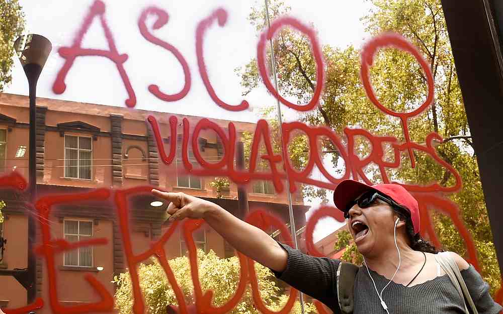 A woman protests in front of the Ministry of Public Security in Mexico City August 12, 2019 after four police officers had been accused of raping a minor in their patrol car in the Azcapotzalco neighborhood last weekend. u00e2u20acu201d AFP pic