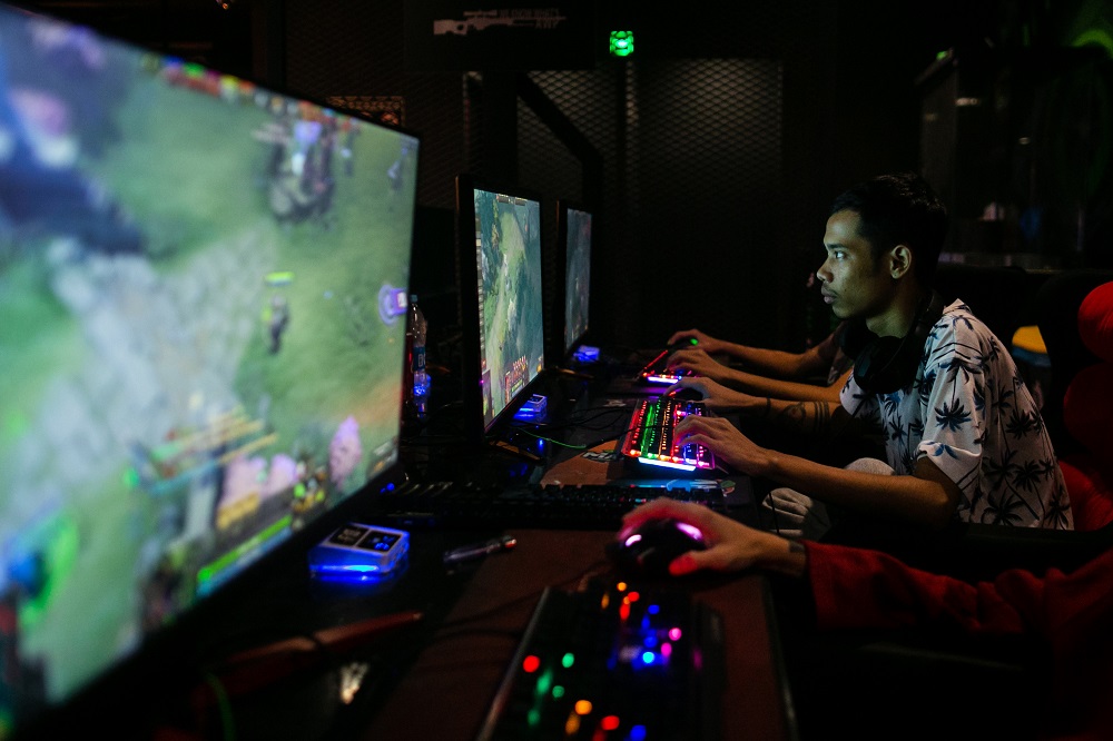 This photo taken on August 22, 2019 shows eSports professional player Myint Myat Zaw, also known as u00e2u20acu02dcInsaneu00e2u20acu2122, playing u00e2u20acu02dcDota 2u00e2u20acu2122 at an eSports shop in Yangon. u00e2u20acu201d AFP pic