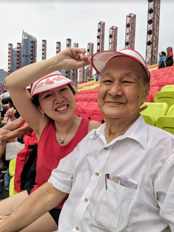 Marie Law, 39, manager, with her 83-year-old father retiree Law Kim Len. Both are attending for the first time. — TODAY pic