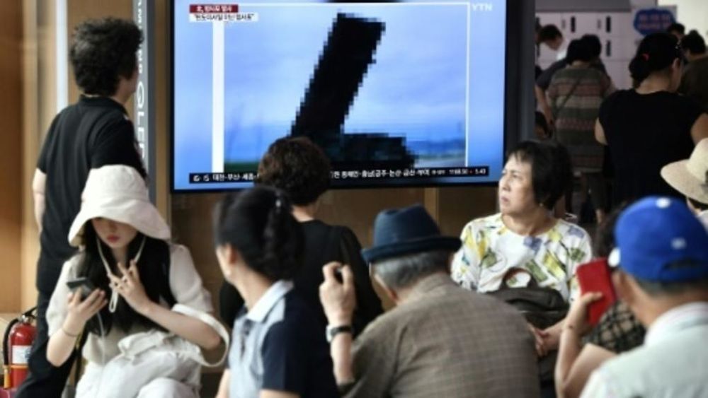 A television news screen shows a heavily pixellated image of North Korea's new rocket launcher. u00e2u20acu201d AFP pic