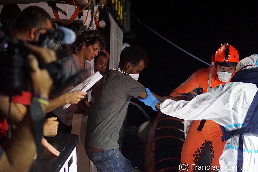 Migrants evacuated by a Spanish rescue ship Open Arms disembark at Lampedusa, Italy in this undated handout picture provided August 19, 2019. u00e2u20acu201d Francisco Gentico/Open Arms handout via Reuters