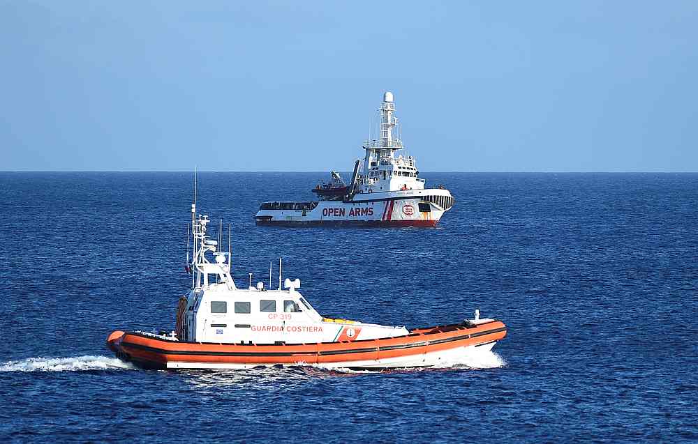 A coast guard boat is seen patrolling near the Spanish migrant rescue ship Open Arms, close to the Italian shore in Lampedusa, Italy August 15, 2019. u00e2u20acu201d Reuters pic