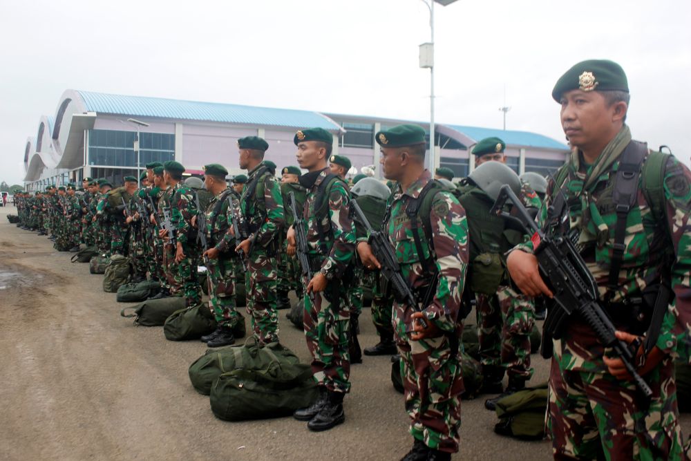Indonesian soldiers stand as they arrive at Domine Eduard Osok Airport to be deployed to Sorong and Manokwari following the protests in Sorong, West Papua August 20, 2019. u00e2u20acu201d Reuters pic