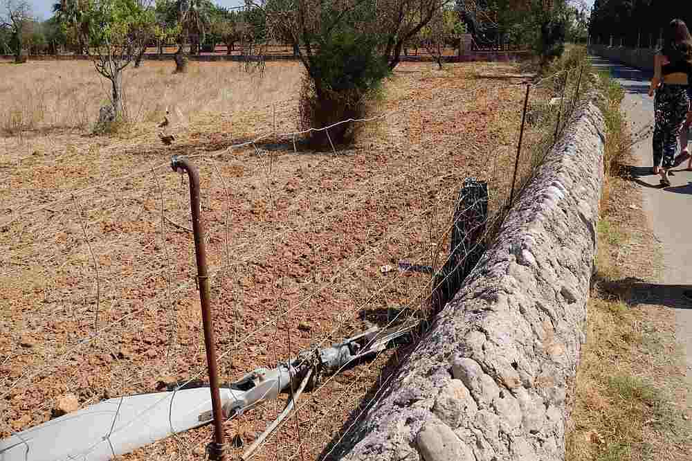 A woman walks past the wreckage of an aircraft in Inca, Spain August 25, 2019. u00e2u20acu201d AFP pic