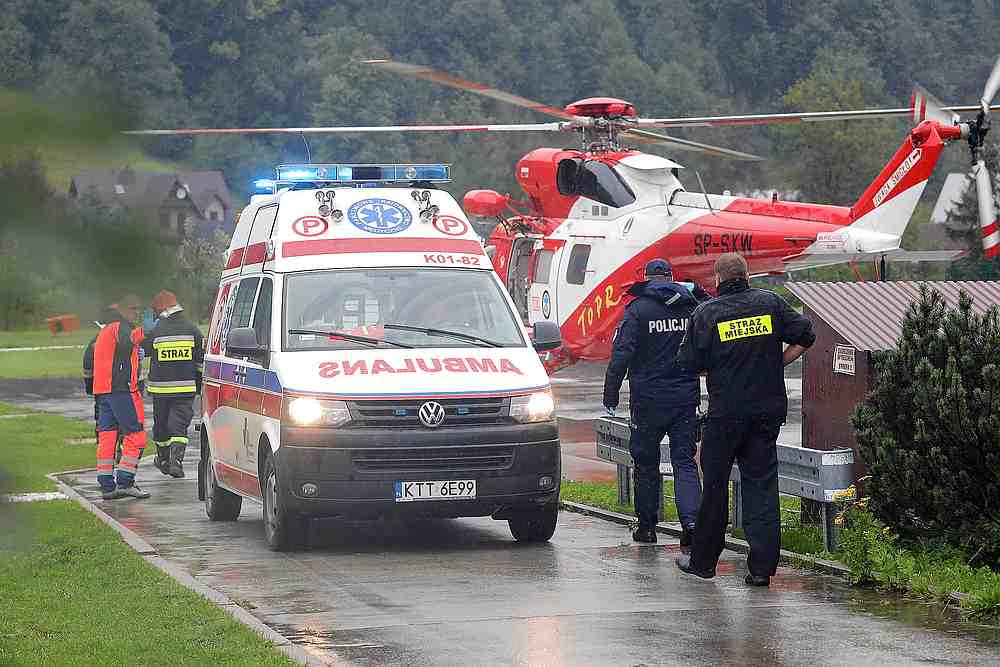 A helicopter and an ambulance are seen during a rescue operation after a thunderstorm in the Tatra Mountains, in Zakopane, Poland August 22, 2019. u00e2u20acu201d Agencja Gazeta/Marek Podmokly pic via Reuters