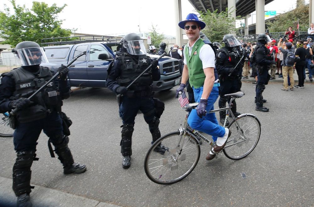 Enforcement officers monitor a alt-right demonstrators as they gather under a bridge during the End Domestic Terrorism rally on August 17, 2019 in Portland, Oregon. u00e2u20acu201d AFP pic