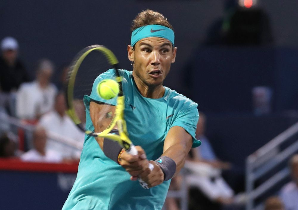 Rafael Nadal of Spain hits a shot against Guido Pella of Greece during the Rogers Cup tennis tournament at Stade IGA. u00e2u20acu201d Reuters pic