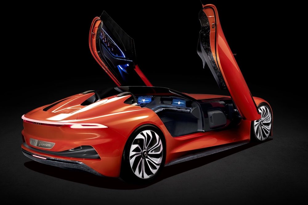 Karma SC1 Vision Concept is painted in a fluorescent orange strongly contrasting the deep indigo and black interior which is revealed after lifting the doors upwards. u00e2u20acu201d Handout via AFP