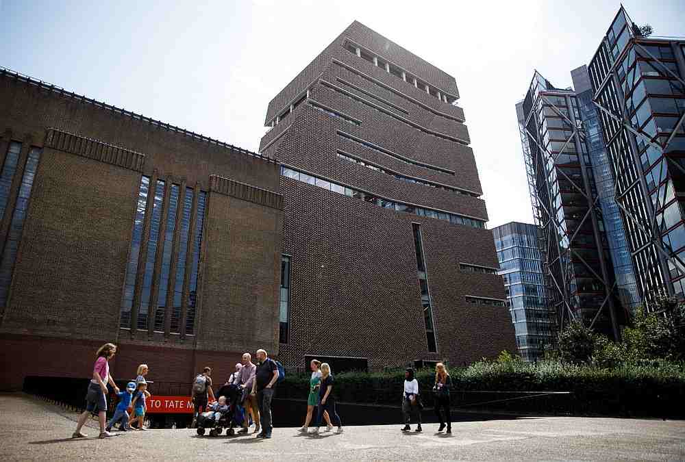 People walk part the Tate Modern gallery in central London August 5, 2019. u00e2u20acu201d AFP pic