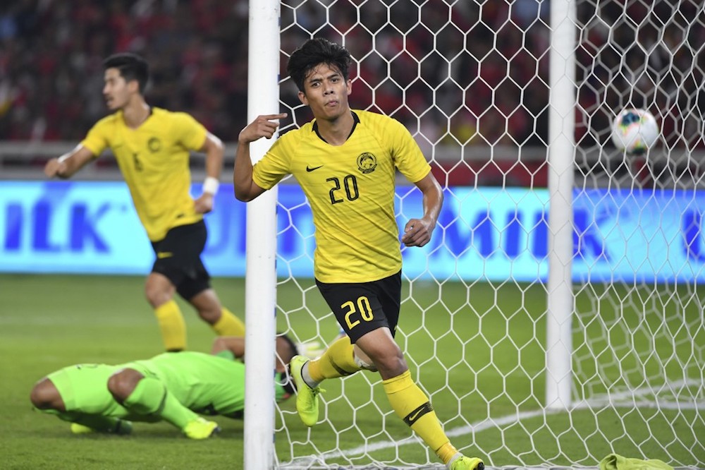Malaysiau00e2u20acu2122s Muhammad Syafiq Ahmad celebrates after scoring a goal during the Fifa World Cup preliminary qualification round 2 at Gelora Bung Karno stadium in Jakarta September 5, 2019. u00e2u20acu201d AFP pic