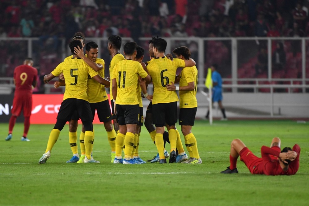 Malaysia's players celebrate their victory after the Fifa world cup preliminary qualification round 2 match against Indonesia at the Gelora Bung Karno stadium in Jakarta September 5, 2019. — AFP pic