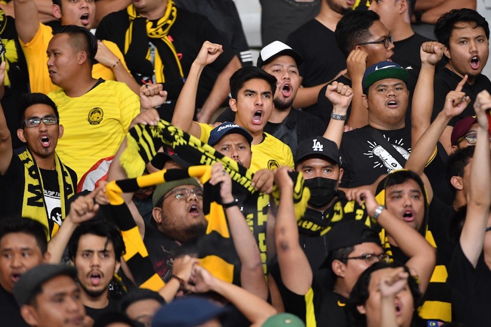 Youth and Sports Minister Syed Saddiq Abdul Rahman shouts slogans during the Fifa World Cup preliminary qualification round 2 between Malaysia and Indonesia at Gelora Bung Karno stadium in Jakarta September 5, 2019. u00e2u20acu201d AFP pic