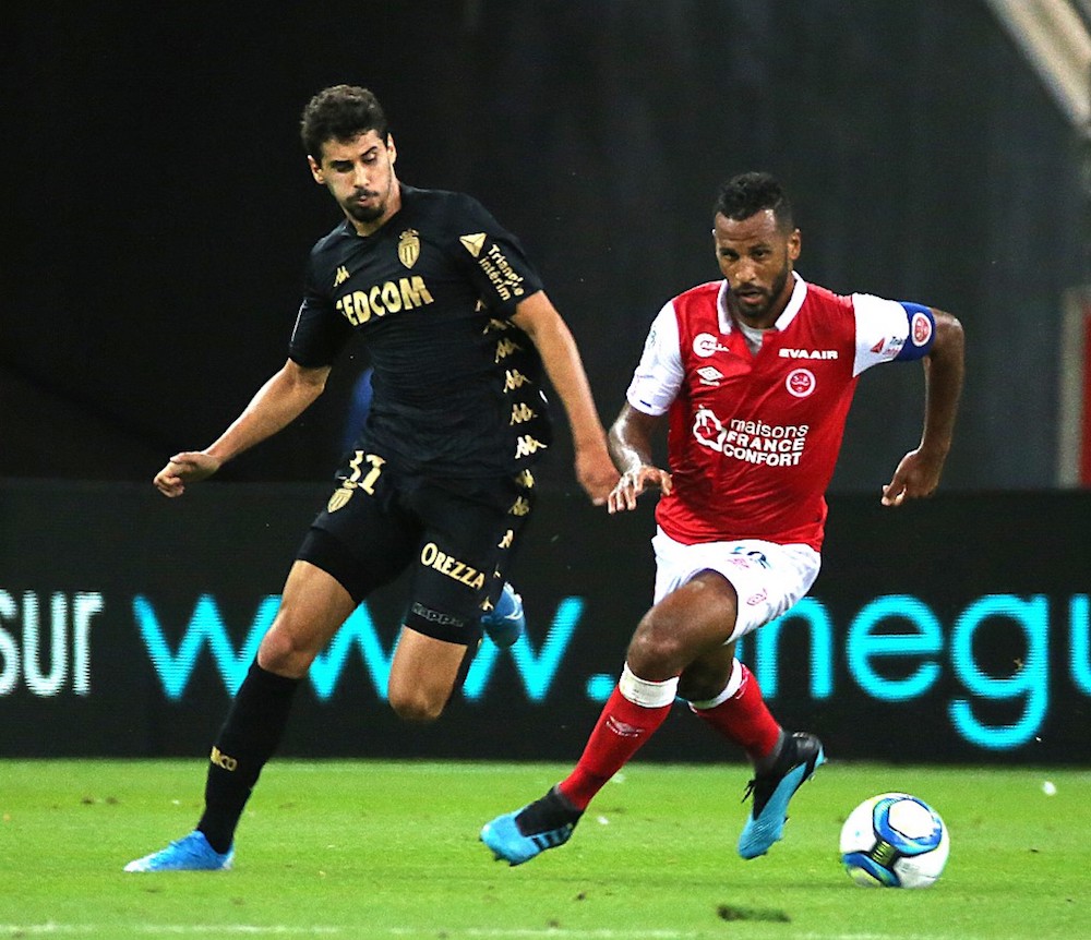 Reimsu00e2u20acu2122 Alaixys Romao vies with Monacou00e2u20acu2122s Gil Bastiao Dias during the L1 match at the Auguste Delaune Stadium in Reims September 21, 2019. u00e2u20acu201d AFP pic