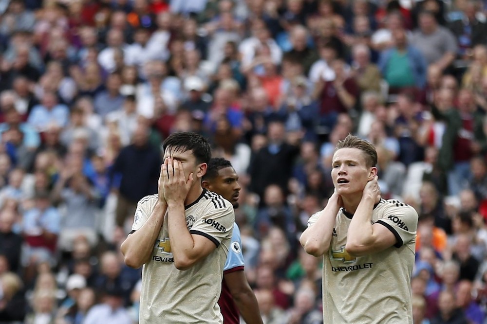 Manchester Unitedu00e2u20acu2122s Harry Maguire reacts to a missed chance at goal as Scott McTominay looks on during the Premier League match with West Ham United at The London Stadium in east London September 22, 2019. u00e2u20acu201d AFP pic