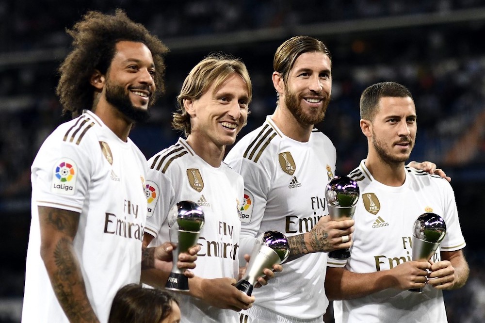 Real Madridu00e2u20acu2122s Marcelo, Luka Modric, Sergio Ramos and Eden Hazard pose with their u00e2u20acu02dcBestu00e2u20acu2122 Fifa Football awards before the La Liga match with Osasuna at Santiago Bernabeu stadium in Madrid September 25, 2019. u00e2u20acu201d AFP pic