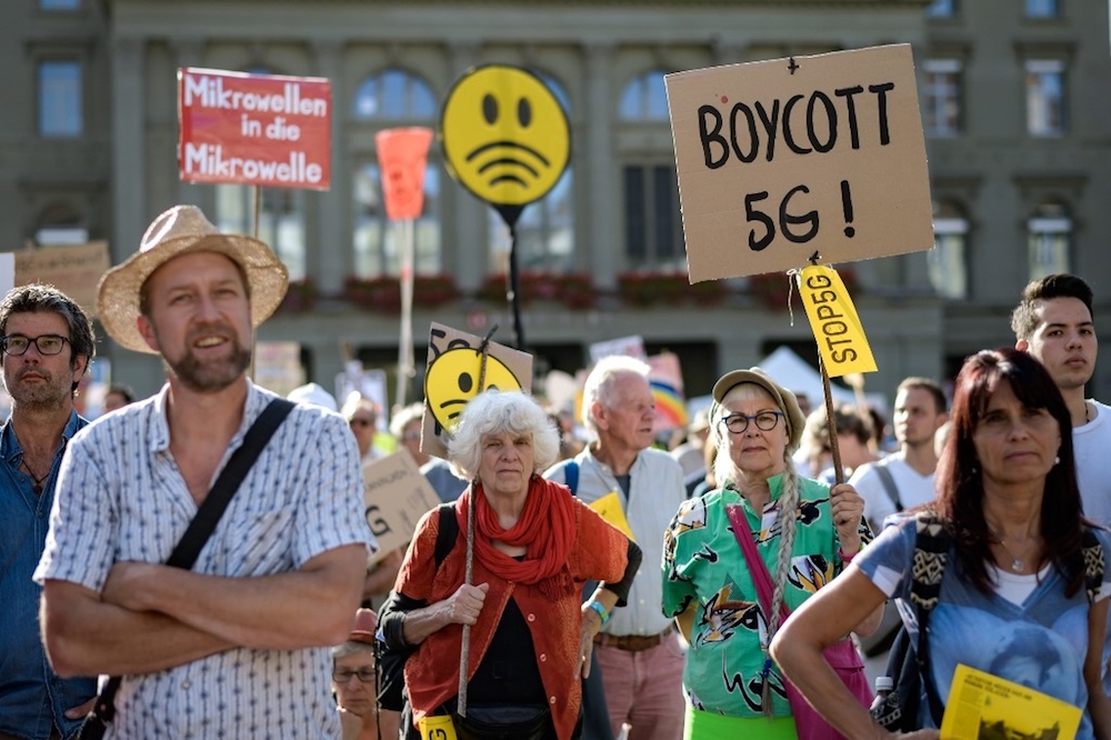 People take part to a nationwide protest against the 5G technology and 5G-compatible antennae deployment in front of the Swiss house of Parliament in Bern September 21, 2019. u00e2u20acu201d AFP pic