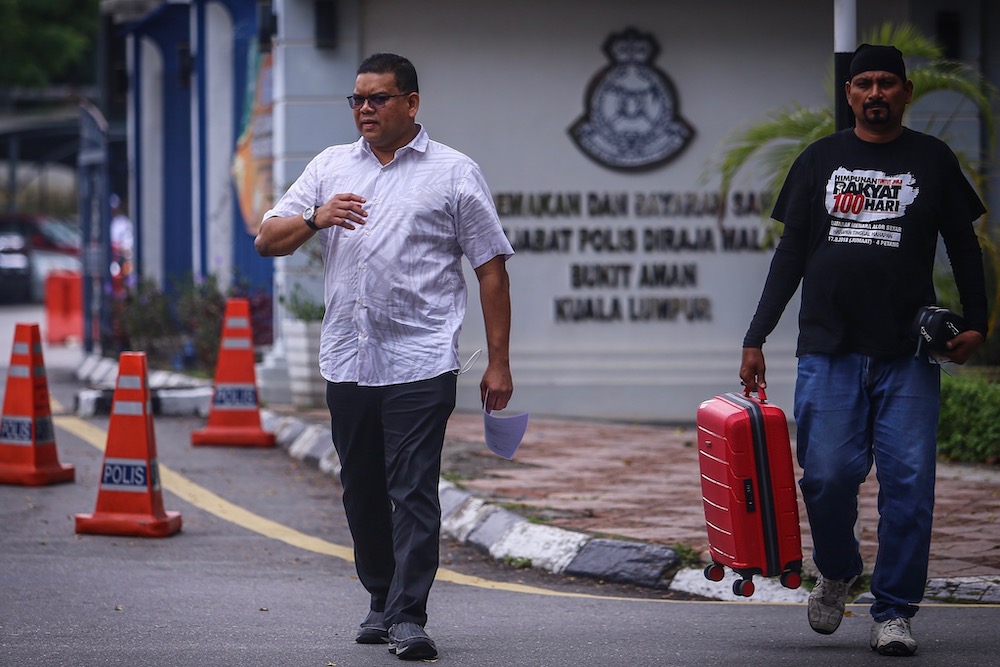 Umno supreme council member Datuk Lokman Noor Adam leaves the Bukit Aman headquarters after giving his statement, September 3, 2019.  u00e2u20acu201d Picture by Hari Anggara