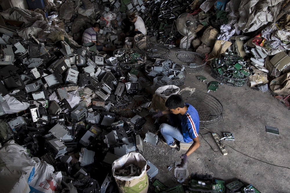 Workers recycle CD players at a workshop in the township of Guiyu in China's southern Guangdong province June 9, 2015. u00e2u20acu201d Reuters pic