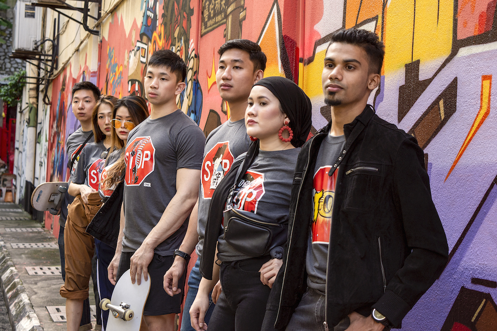 Street Art Campaign T-shirts by ONE feature artwork to raise awareness about HIV/AIDS. –—Picture courtesy of Karex Berhad