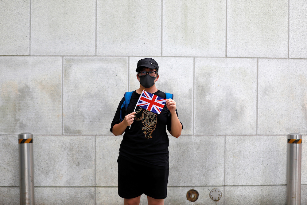 A man holds the British Union Jack flag during a protest outside British Consulate-general office in Hong Kong August 21, 2019. u00e2u20acu201d Reuters pic