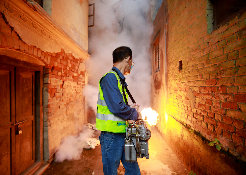 A worker fumigates a resident area to prevent the spread of the dengue fever and other mosquito-borne diseases in Kathmandu September 5, 2019. u00e2u20acu201d Reuters pic