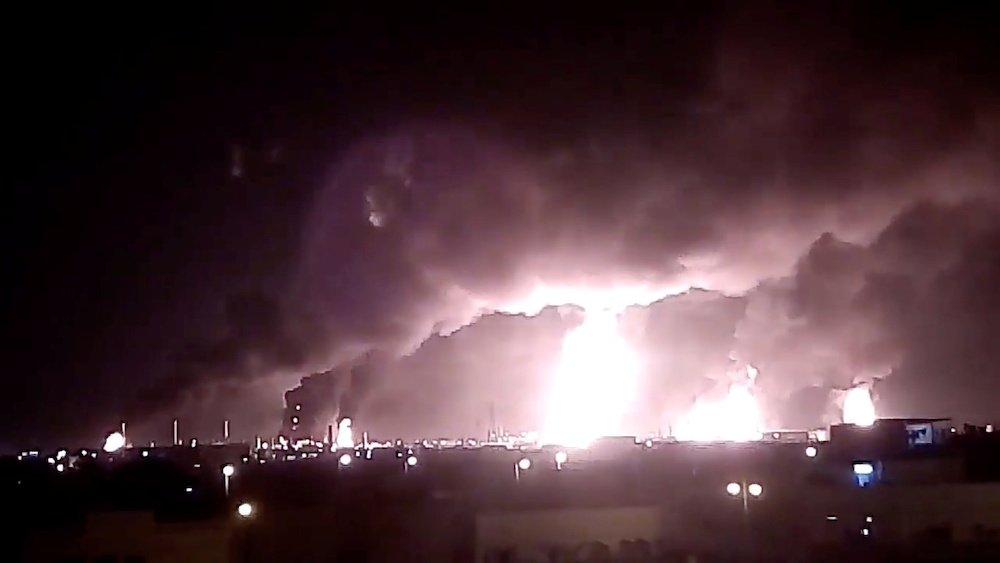 Fires burn in the distance after a drone strike by Yemen's Iran-aligned Houthi group on Saudi company Aramco's oil processing facilities, in Buqayq September 14, 2019 in this still image taken from a social media video obtained by Reuters. u00e2u20acu201d Social medi