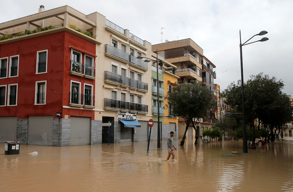A man walks through a flooded street as torrential rains hit Orihuela, Spain, September 13, 2019. u00e2u20acu201d Reuters pic