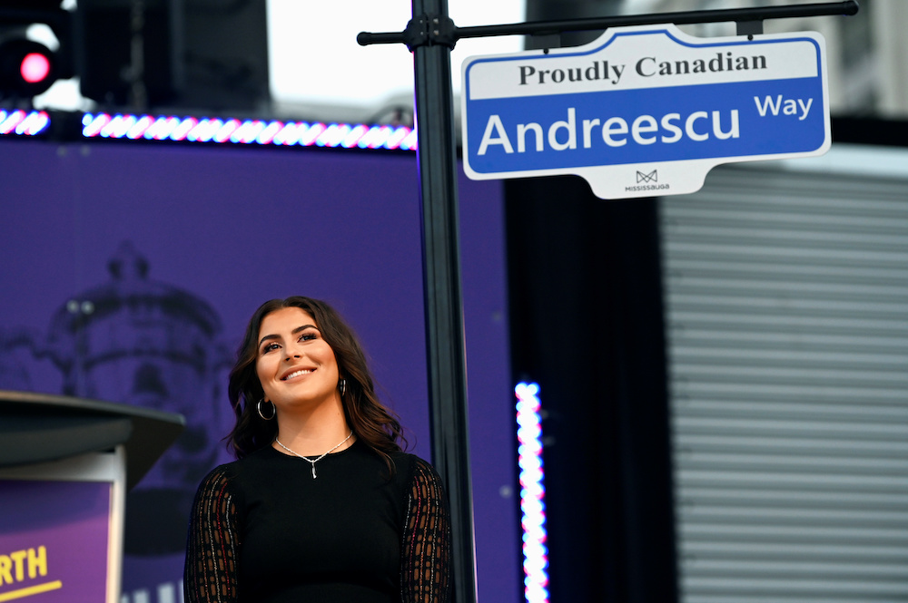US Open tennis champion Bianca Andreescu with a sign naming a street for Andreescu at the u00e2u20acu02dcShe The Northu00e2u20acu2122 celebration rally in Mississauga, Ontario September 15, 2019. u00e2u20acu201d Reuters pic